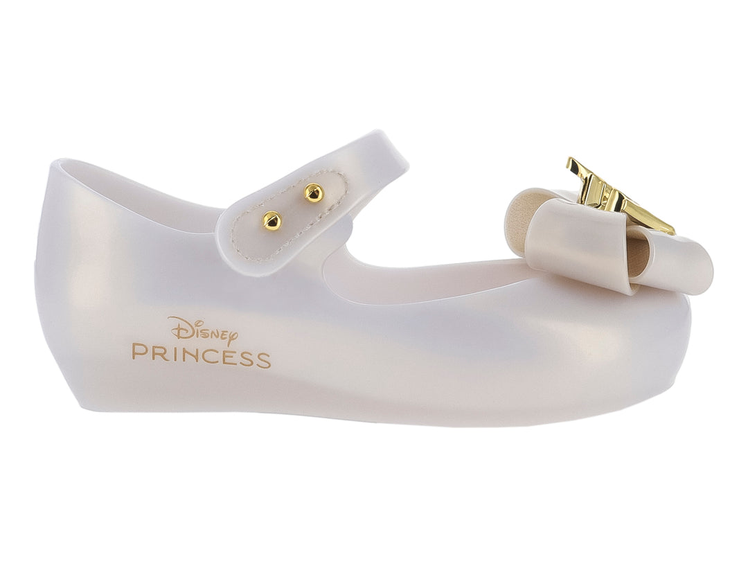 Zapato beige para niña Mini Melissa con moño y detalles dorados, diseño Disney Princess.