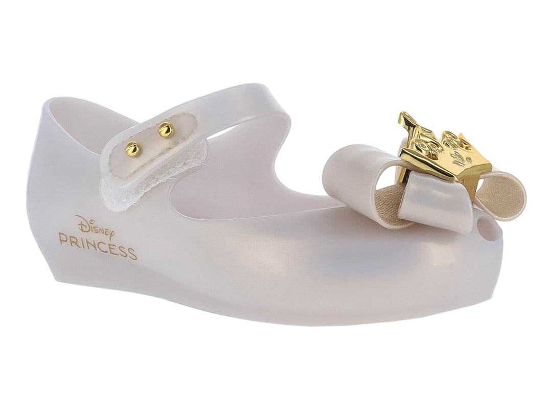 Zapato beige para niña Mini Melissa con moño y detalles dorados, diseño Disney Princess.