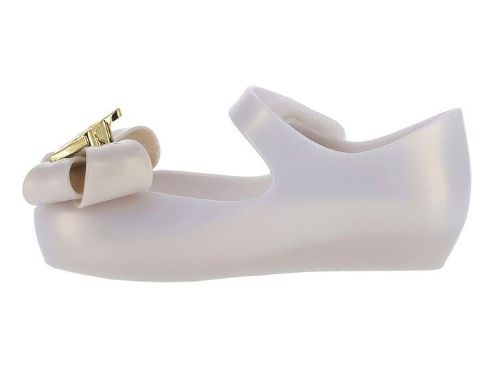 Zapato beige para niña Mini Melissa con moño y detalles dorados, diseño Disney Princess.