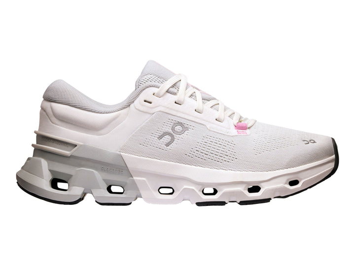 Tenis deportivos On Cloud color blanco y gris con suela tecnológica y detalles en rosa.