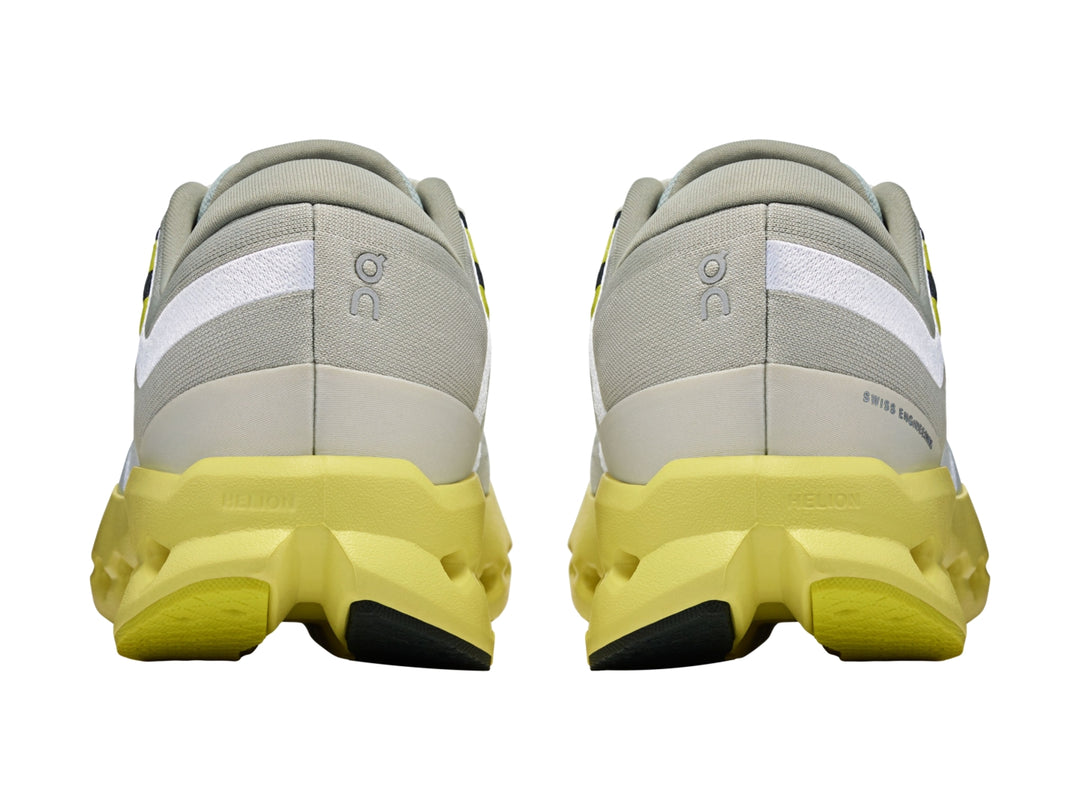 Tenis deportivos On Cloudsurf 2 en color gris glacier con suela amarilla limelight y detalles blancos.