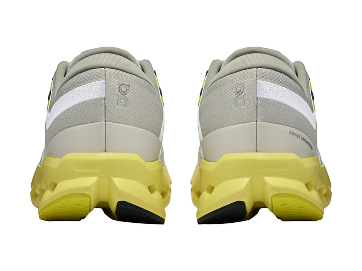 Tenis deportivos On Cloudsurf 2 en color gris glacier con suela amarilla limelight y detalles blancos.
