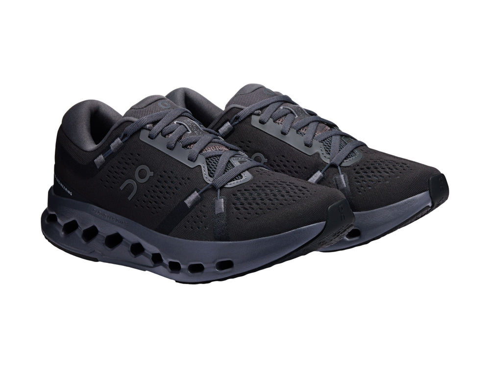 Tenis deportivos On Cloudsurfer 2 color negro con suela de celdas huecas y malla transpirable.