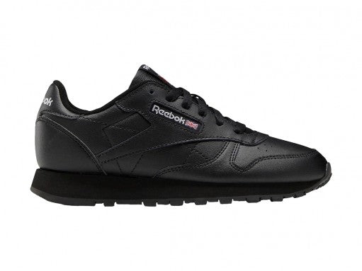 Tenis Reebok Classic Leather en color negro total con suela negra y detalles de marca en blanco.
