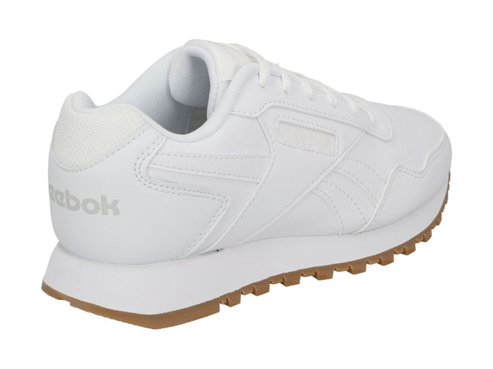 Tenis Reebok blancos con suela de goma marrón, diseño deportivo y casual.
