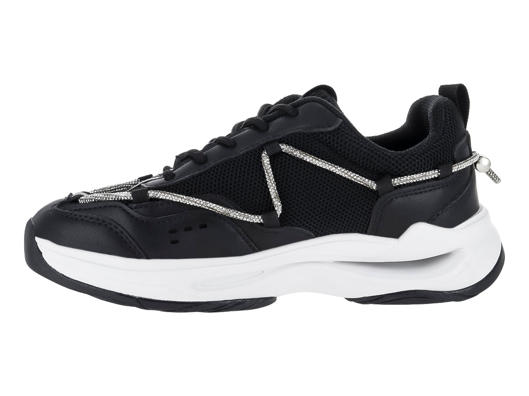 Tenis deportivos Clasben Karen en color negro con suela blanca gruesa y detalles de cordones decorativos grises.