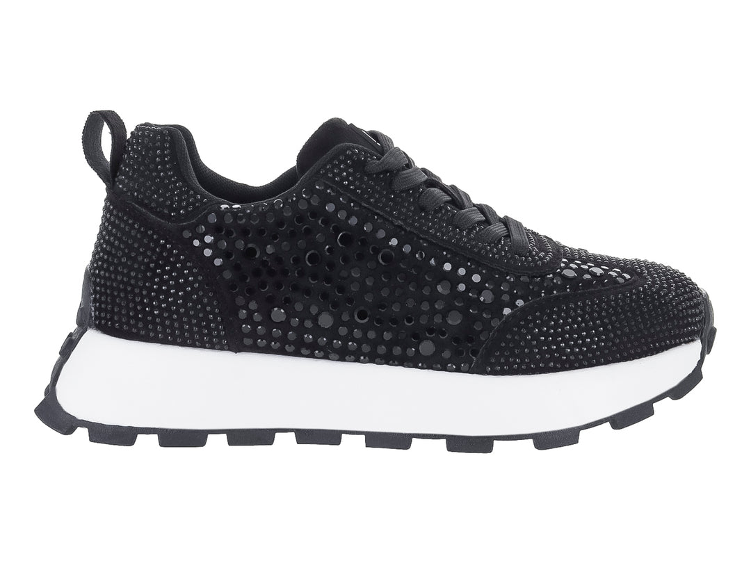 Tenis negros para mujer con detalles de pedrería brillante y suela blanca dentada.