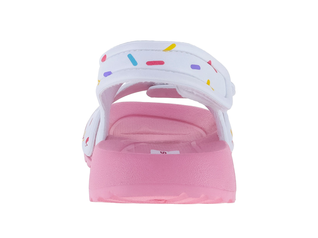 Sandalia infantil rosa y blanca con diseño de chispas de colores y un adorno de dona.