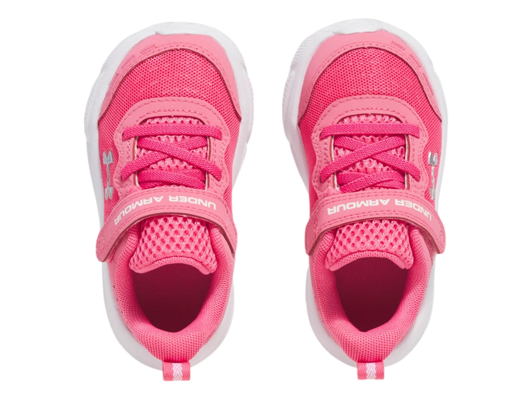 Tenis deportivos Under Armour color rosa con suela blanca y cierre de velcro para Niña.