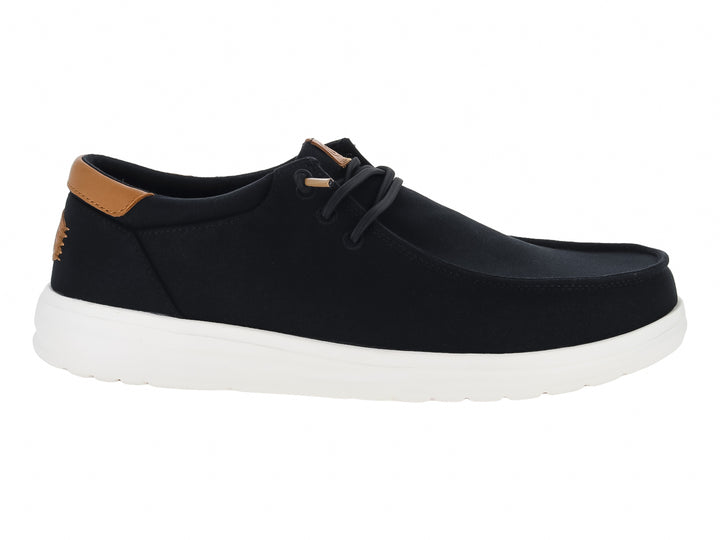 Zapato casual Hey Dude Paul de lona color negro con suela blanca y detalle café en el talón.