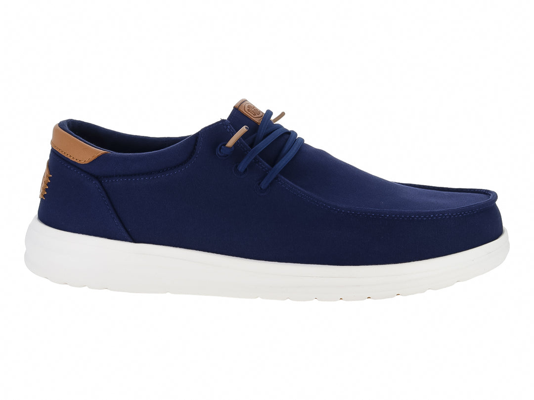 Zapato casual Hey Dude color azul marino con suela blanca y detalles en café.