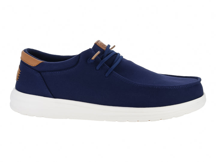 Zapato casual Hey Dude color azul marino con suela blanca y detalles en café.
