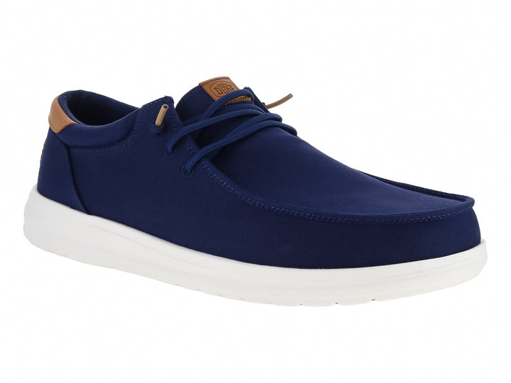 Zapato casual Hey Dude color azul marino con suela blanca y detalles en café.