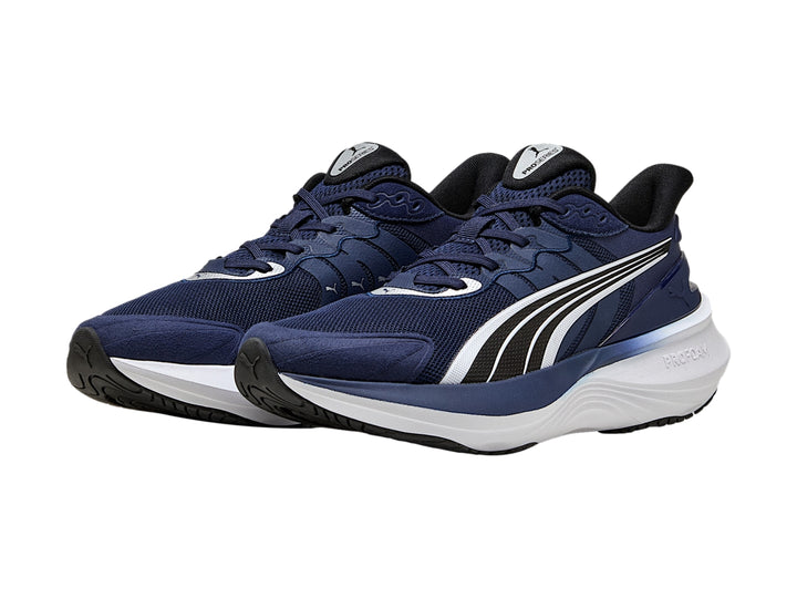 Tenis PUMA Pulse Pro en color azul marino con suela blanca y detalles en negro.