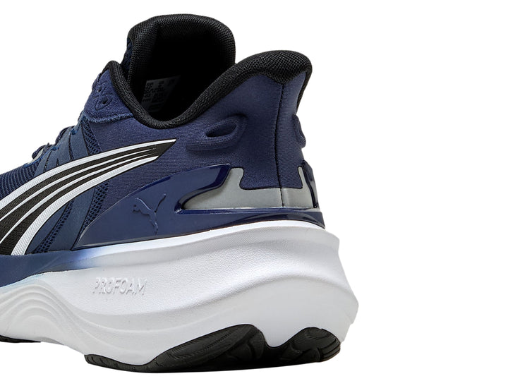 Tenis PUMA Pulse Pro en color azul marino con suela blanca y detalles en negro.