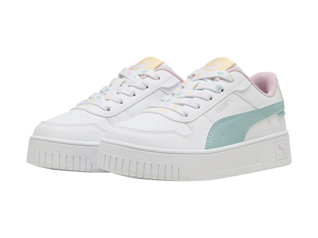 Tenis PUMA blancos con suela de plataforma y detalles en verde menta y rosa.