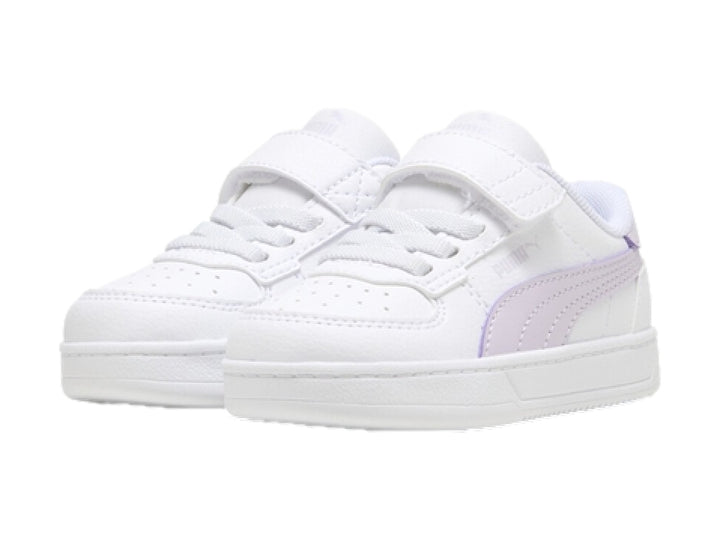 Tenis PUMA blancos con detalles en color lila y cierre de velcro para Niño.