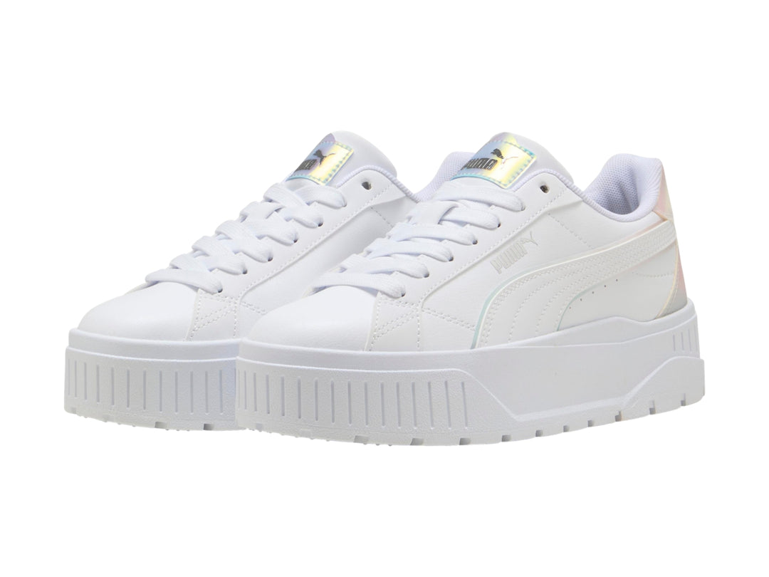 Tenis PUMA blancos para niños con suela de plataforma y detalles laterales en color holográfico.
