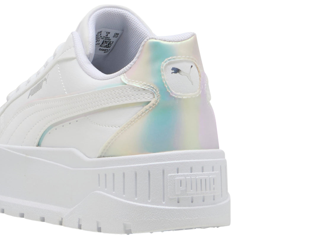 Tenis PUMA blancos para niños con suela de plataforma y detalles laterales en color holográfico.