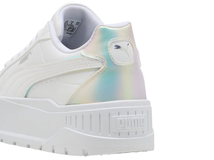 Tenis PUMA blancos para niños con suela de plataforma y detalles laterales en color holográfico.