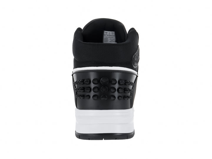 Tenis tipo botín marca Clasben en color negro con suela blanca y detalles decorativos laterales.