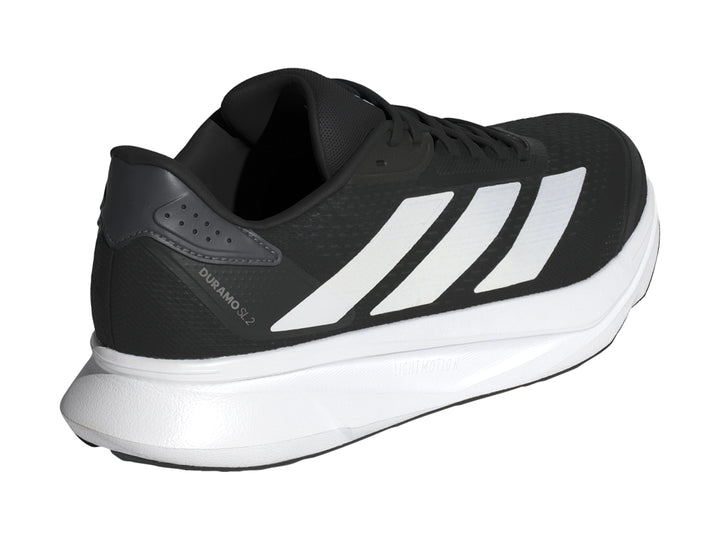 Tenis deportivos Adidas Duramo SL2 color negro con detalles y suela en color blanco.