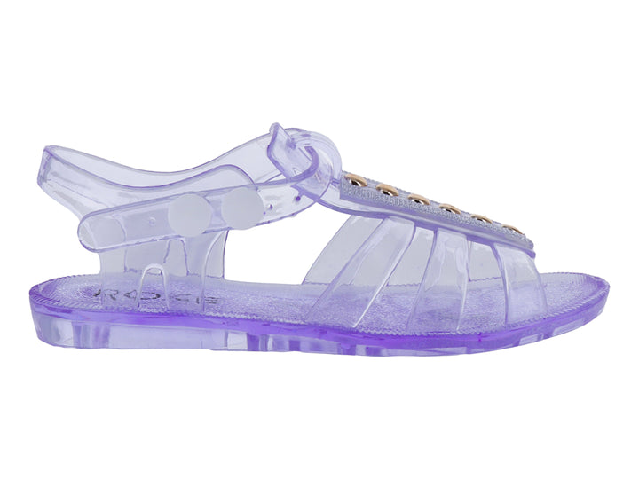 Sandalia infantil de plástico transparente color morado con detalles dorados en la correa.