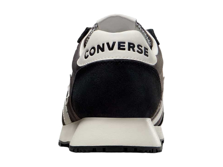 Tenis Converse Omega Trainer en color negro con detalles y suela en blanco, vista lateral.
