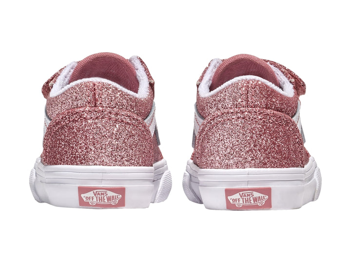 Tenis Vans Old Skool color rosa dorado con glitter, suela blanca y cierres de velcro.