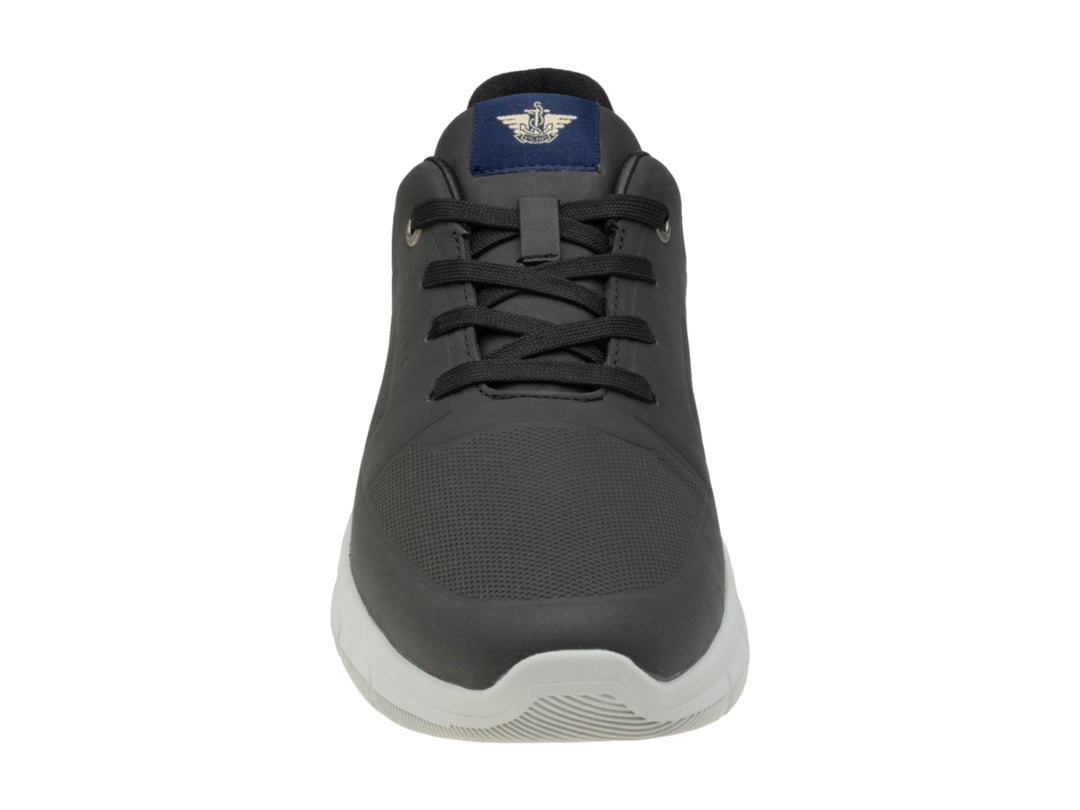 Zapato casual Dockers de color negro con suela blanca y agujetas.