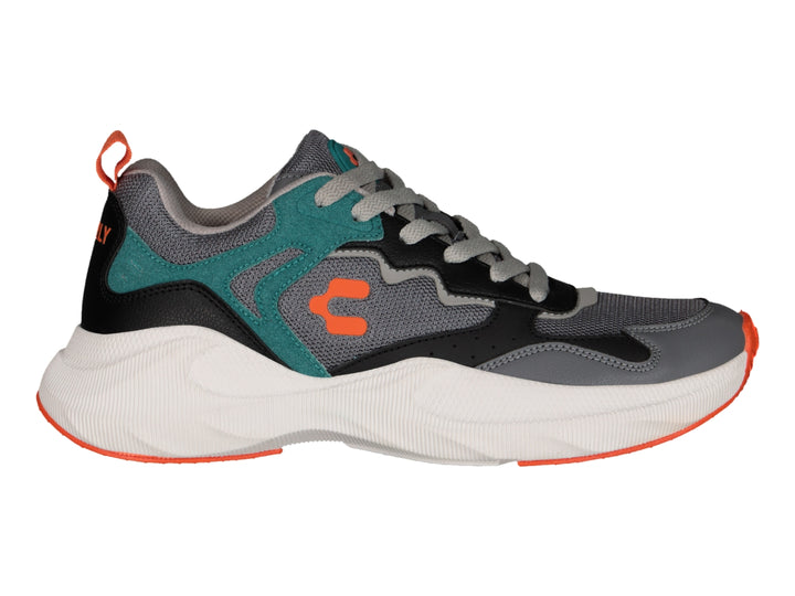 Tenis deportivos Charly color gris con detalles en verde azulado, negro y naranja, con suela blanca gruesa.