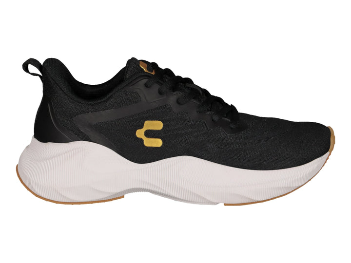 Tenis deportivos Charly color negro con suela blanca y logotipo dorado.