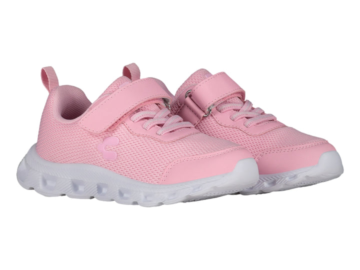 Tenis deportivos color rosa con suela blanca y cierre de cinta adhesiva.