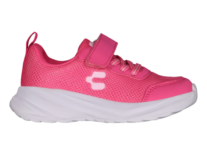 Tenis deportivos infantiles color rosa fucsia con suela blanca y cierre de velcro.