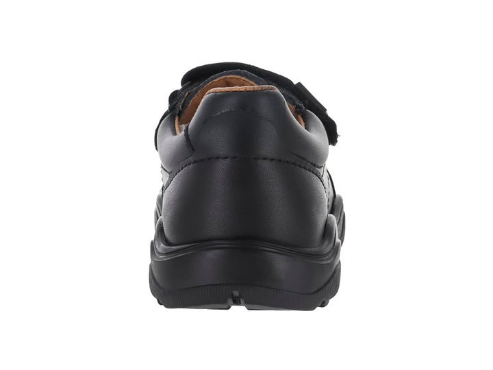 Zapato casual color negro para niño o niña con cierre de dos correas de velcro y suela robusta.