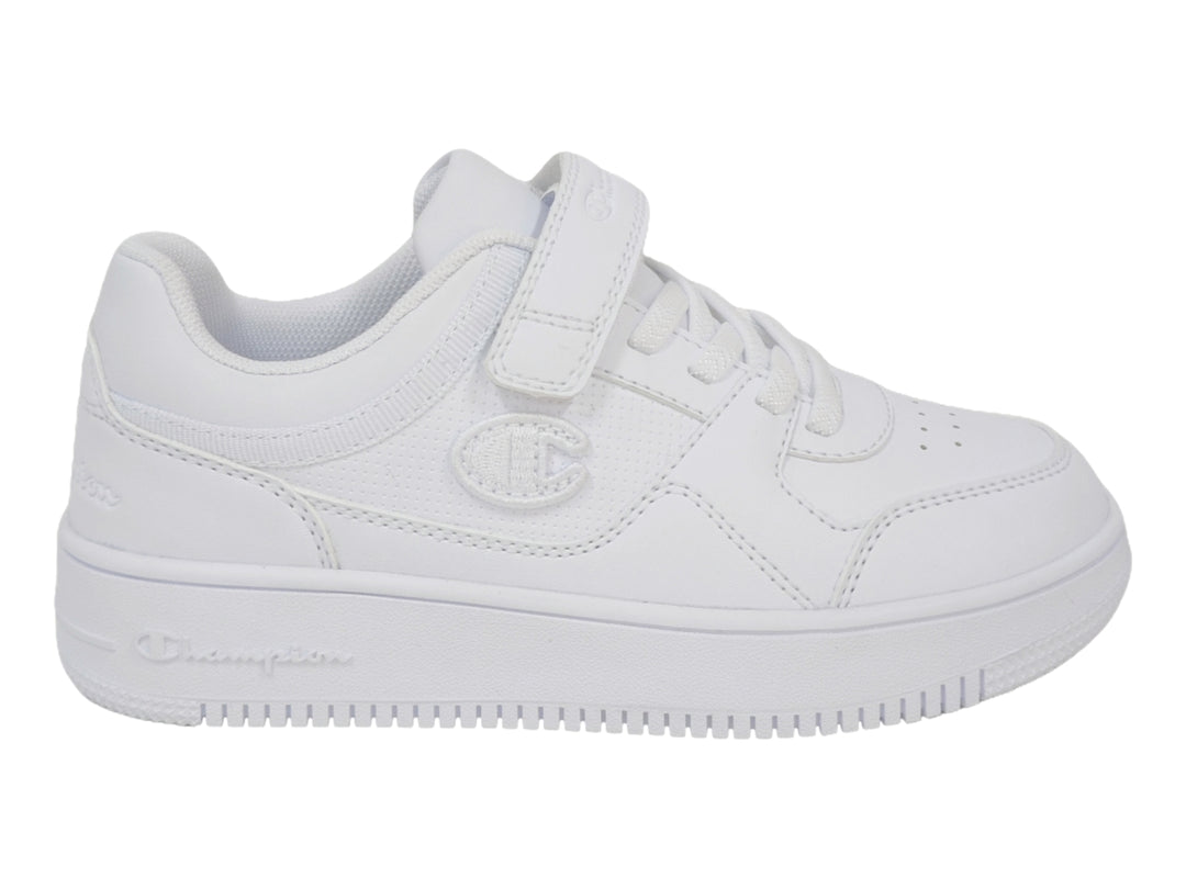 Tenis deportivos Champion color blanco para niño o niña con cierre de velcro y agujetas.