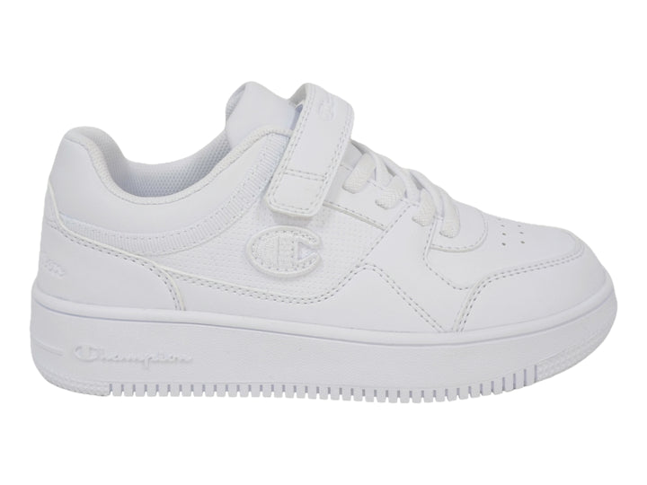 Tenis deportivos Champion color blanco para niño o niña con cierre de velcro y agujetas.