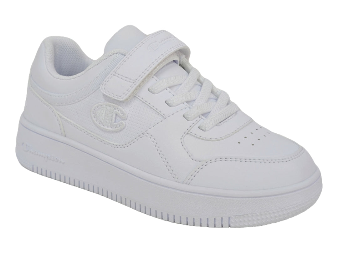 Tenis deportivos Champion color blanco para niño o niña con cierre de velcro y agujetas.
