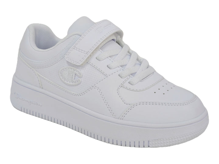 Tenis deportivos Champion color blanco para niño o niña con cierre de velcro y agujetas.