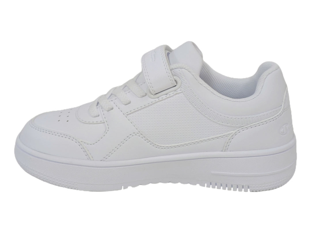 Tenis deportivos Champion color blanco para niño o niña con cierre de velcro y agujetas.