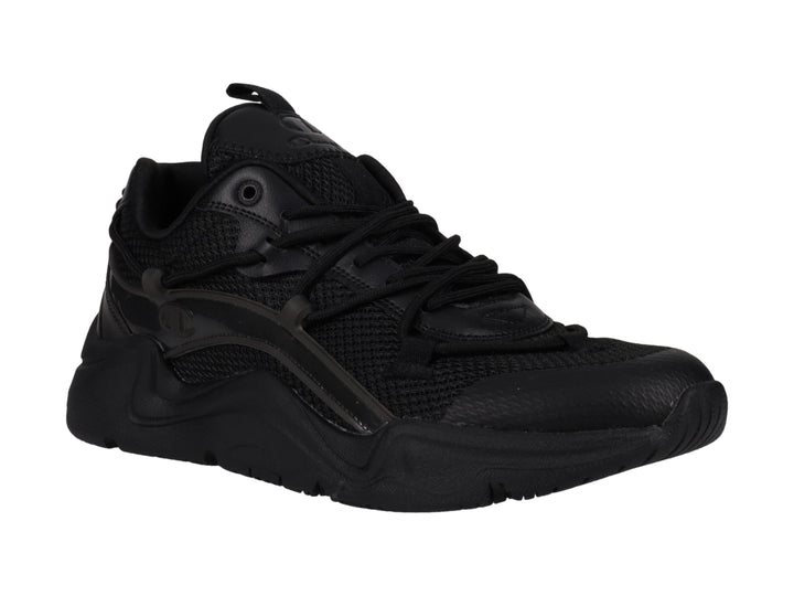 Tenis deportivos Champion color negro con suela gruesa y detalles en malla y material sintético.