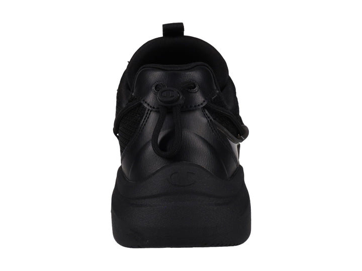 Tenis deportivos Champion color negro con suela gruesa y detalles en malla y material sintético.