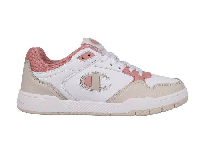 Tenis Champion blancos con detalles en beige y rosa, diseño de corte bajo y suela blanca.