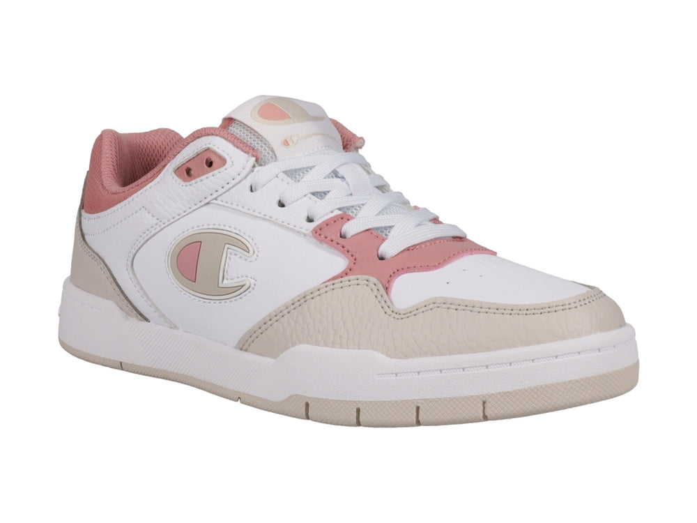 Tenis Champion blancos con detalles en beige y rosa, diseño de corte bajo y suela blanca.