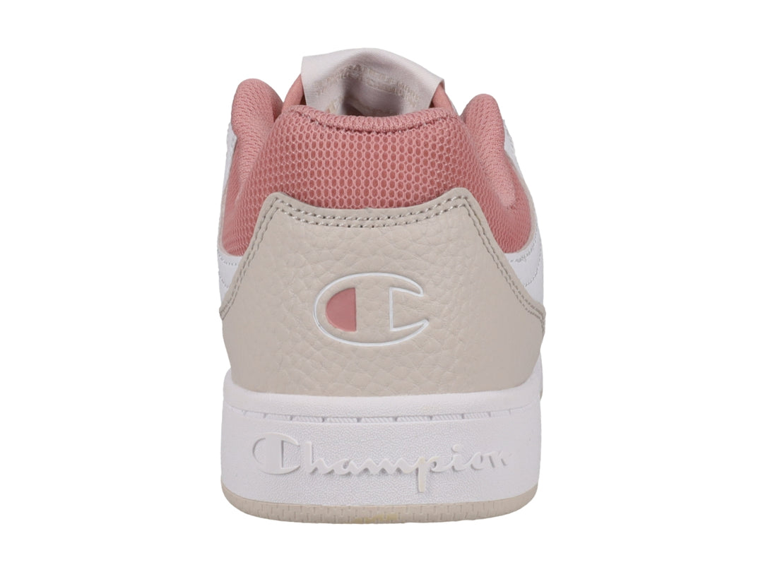 Tenis Champion blancos con detalles en beige y rosa, diseño de corte bajo y suela blanca.