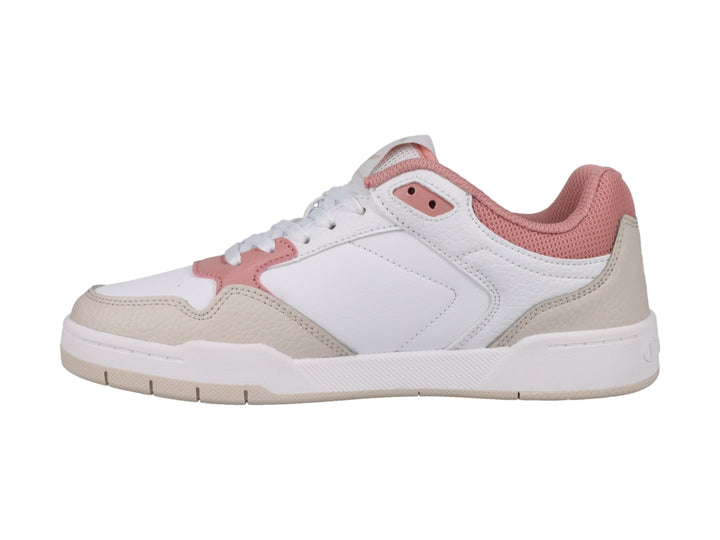 Tenis Champion blancos con detalles en beige y rosa, diseño de corte bajo y suela blanca.