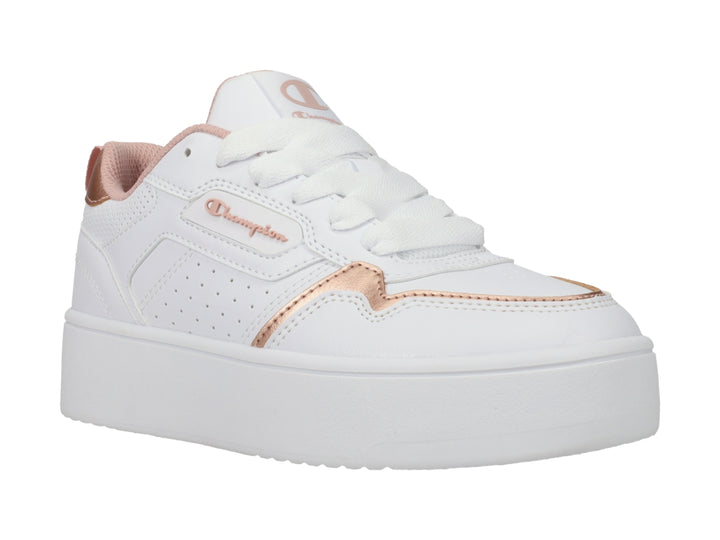 Tenis Champion blancos de plataforma con detalles en color oro rosa.