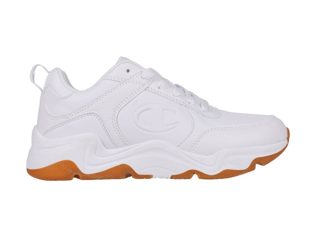 Tenis Champion blancos con suela de goma color café, diseño deportivo y moderno.