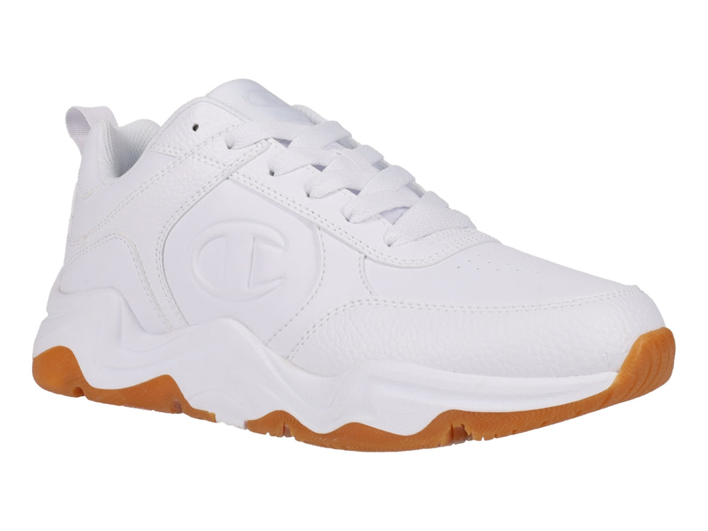 Tenis Champion blancos con suela de goma color caramelo y diseño deportivo.