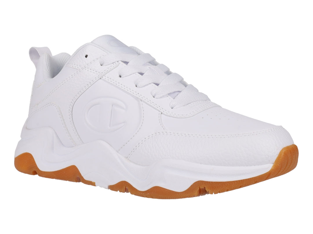 Tenis Champion blancos con suela de goma color caramelo y diseño deportivo.